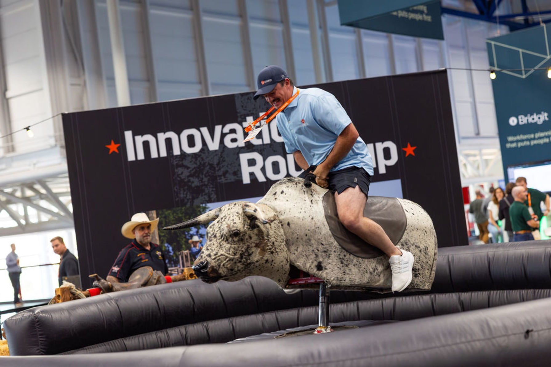 Groundbreak attendee riding a mechanic bull