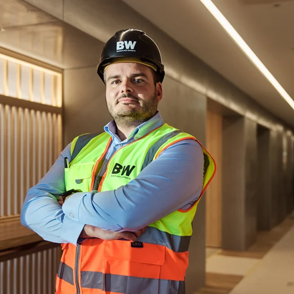 A contractor crossing his arms in front of his body posing for the camera