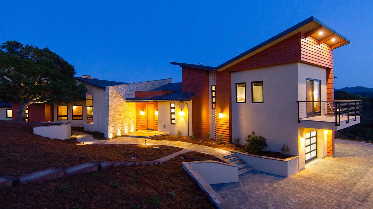Side view of a modern home at night