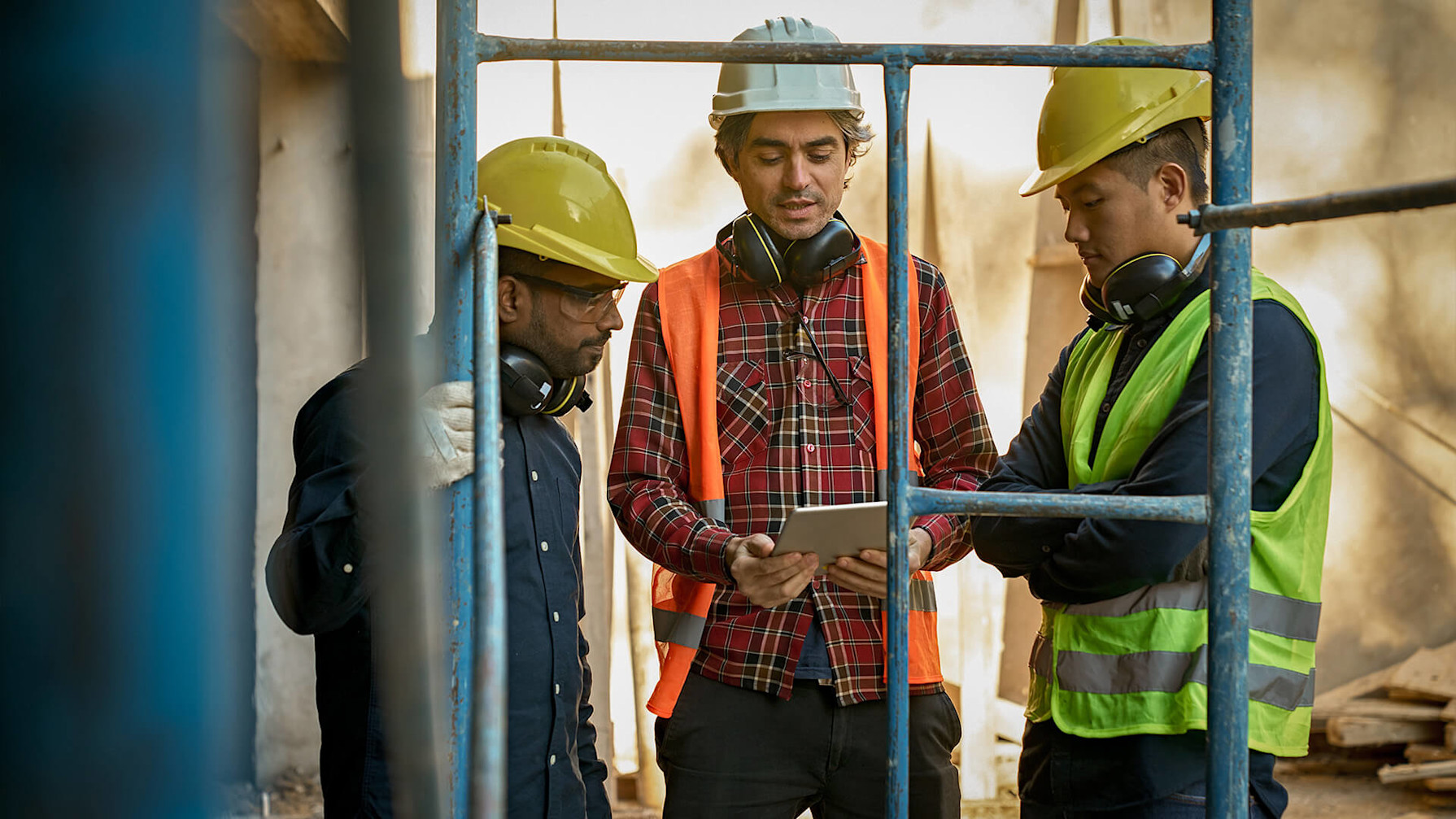 Construction workers using mobile devices on a jobsite