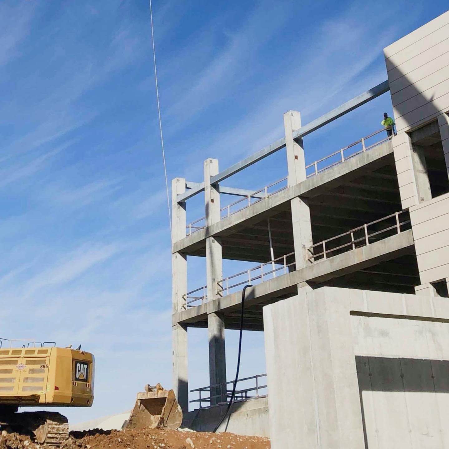 Exterior building under construction with heavy machinery