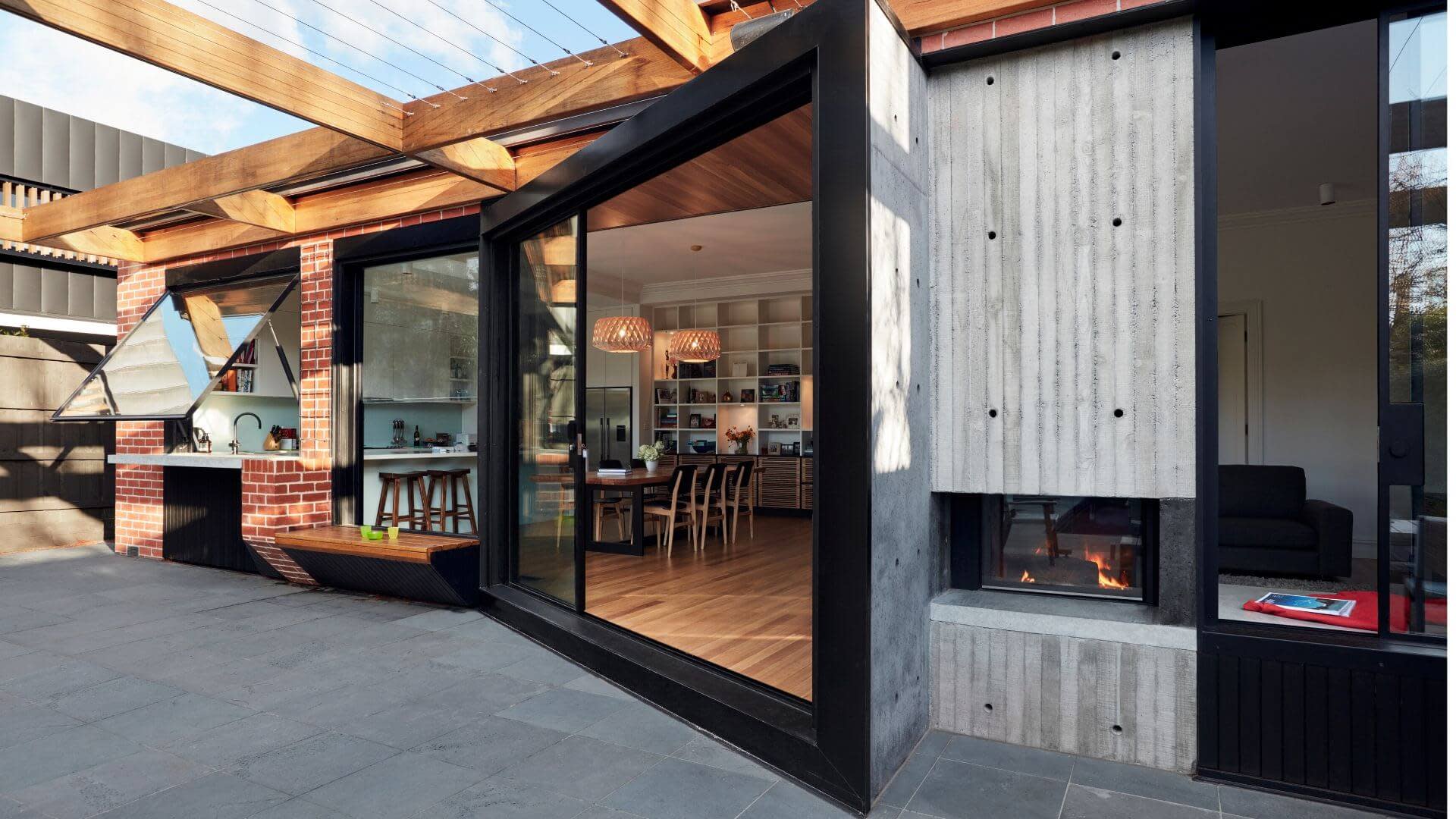 Modern balcony shot with wood frames and corrugated ion screens.