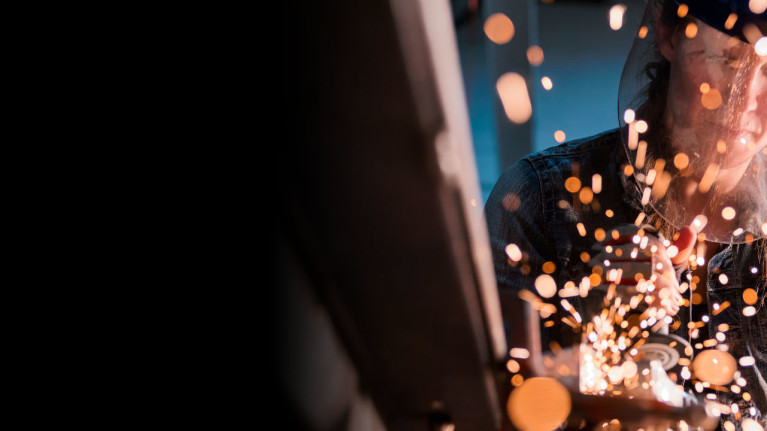 Construction worker welding a piece