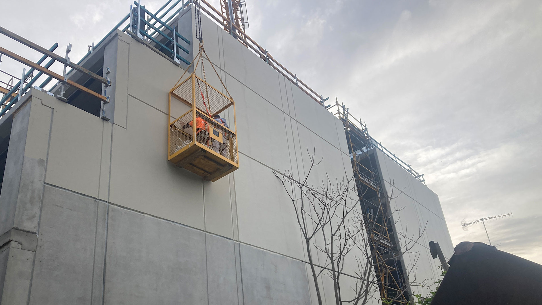 Construction workers on site on a D5 Build Project in a lift