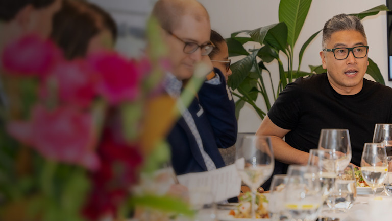a group of people sitting at a table