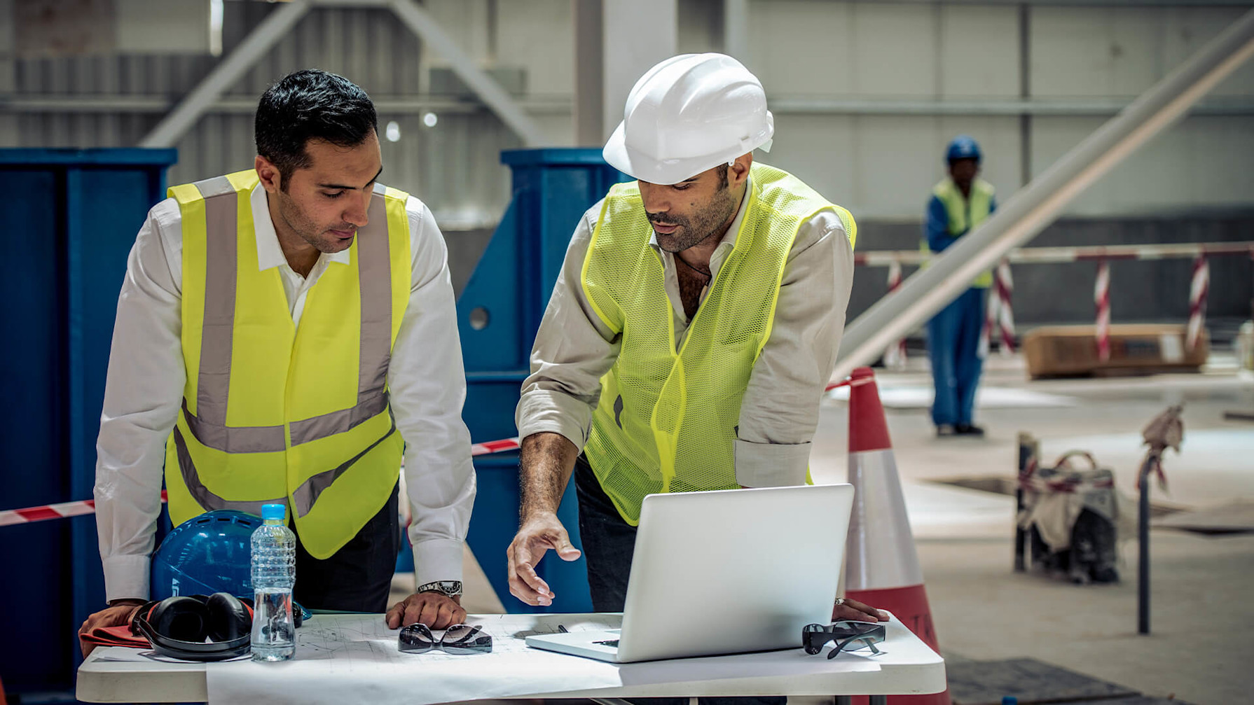 Construction workers using mobile devices on a jobsite