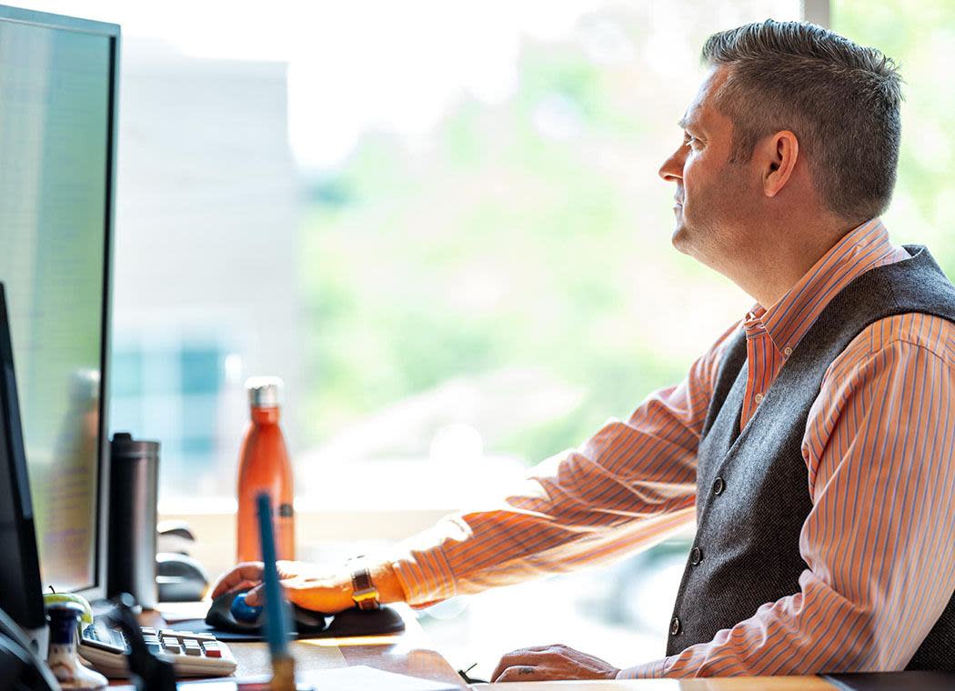 Office worker using his computer