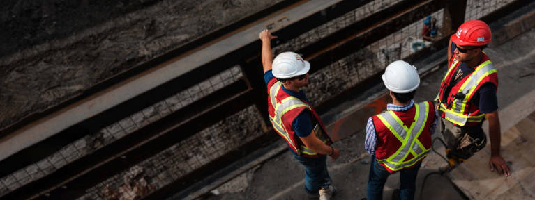 Construction workers on a jobsite seen from above