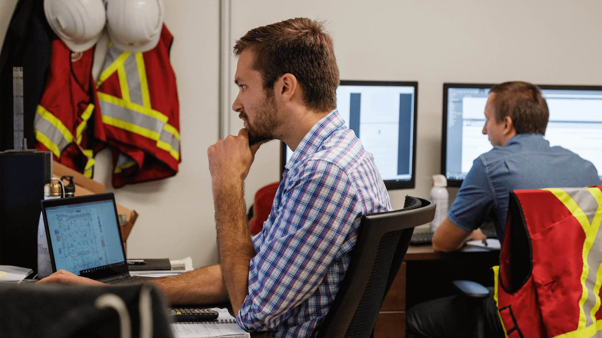 Architects working on blueprints on their computers