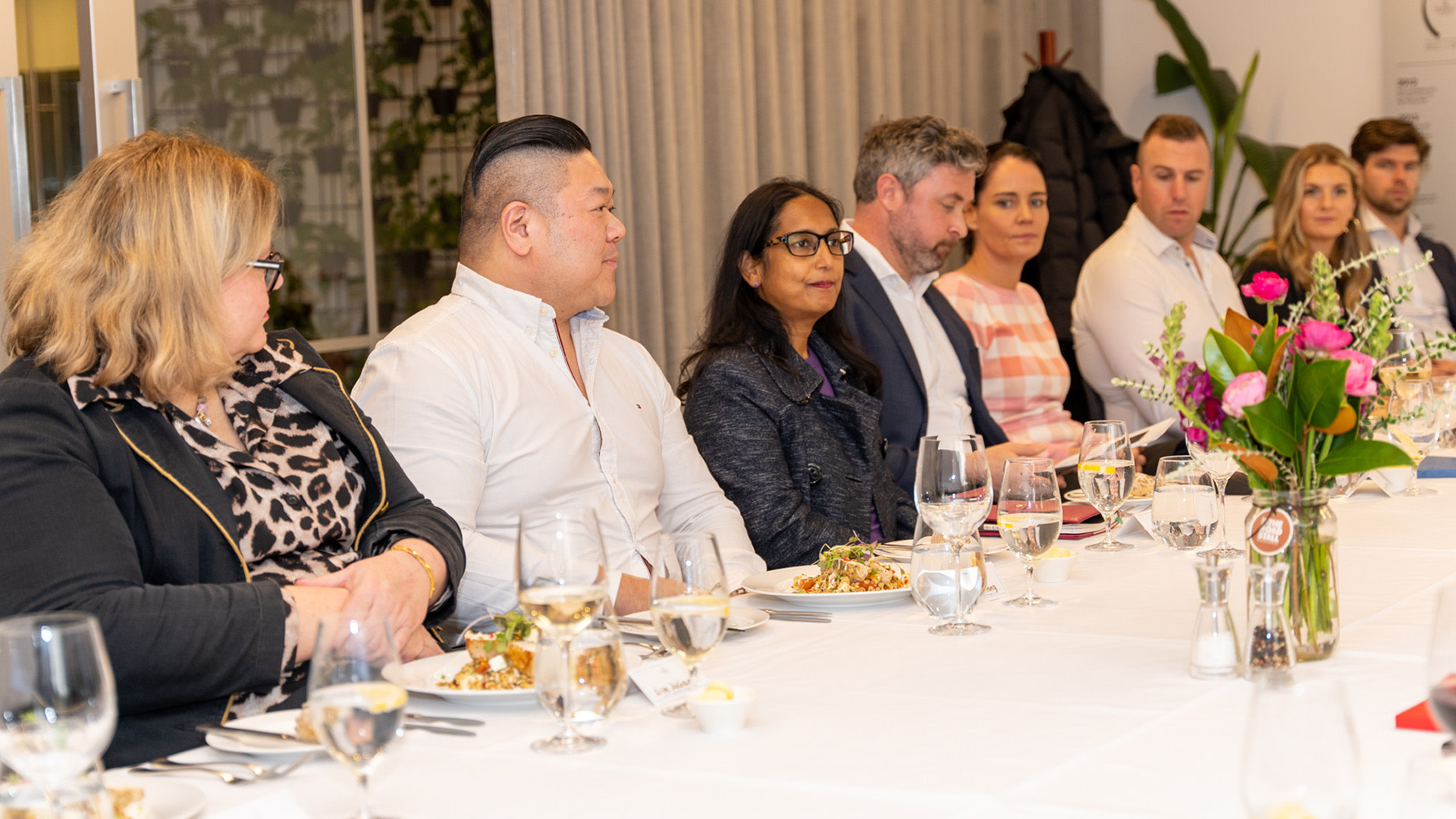 a group of people sitting at a table