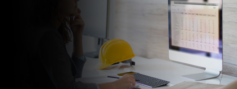 Contractor working on a computer