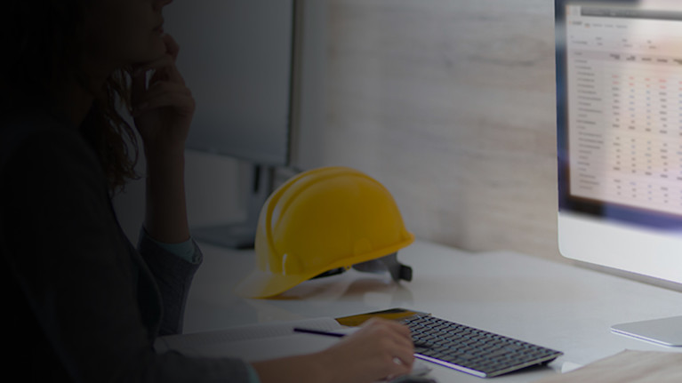 Contractor working on a computer