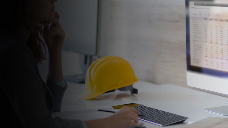 Contractor working on a computer