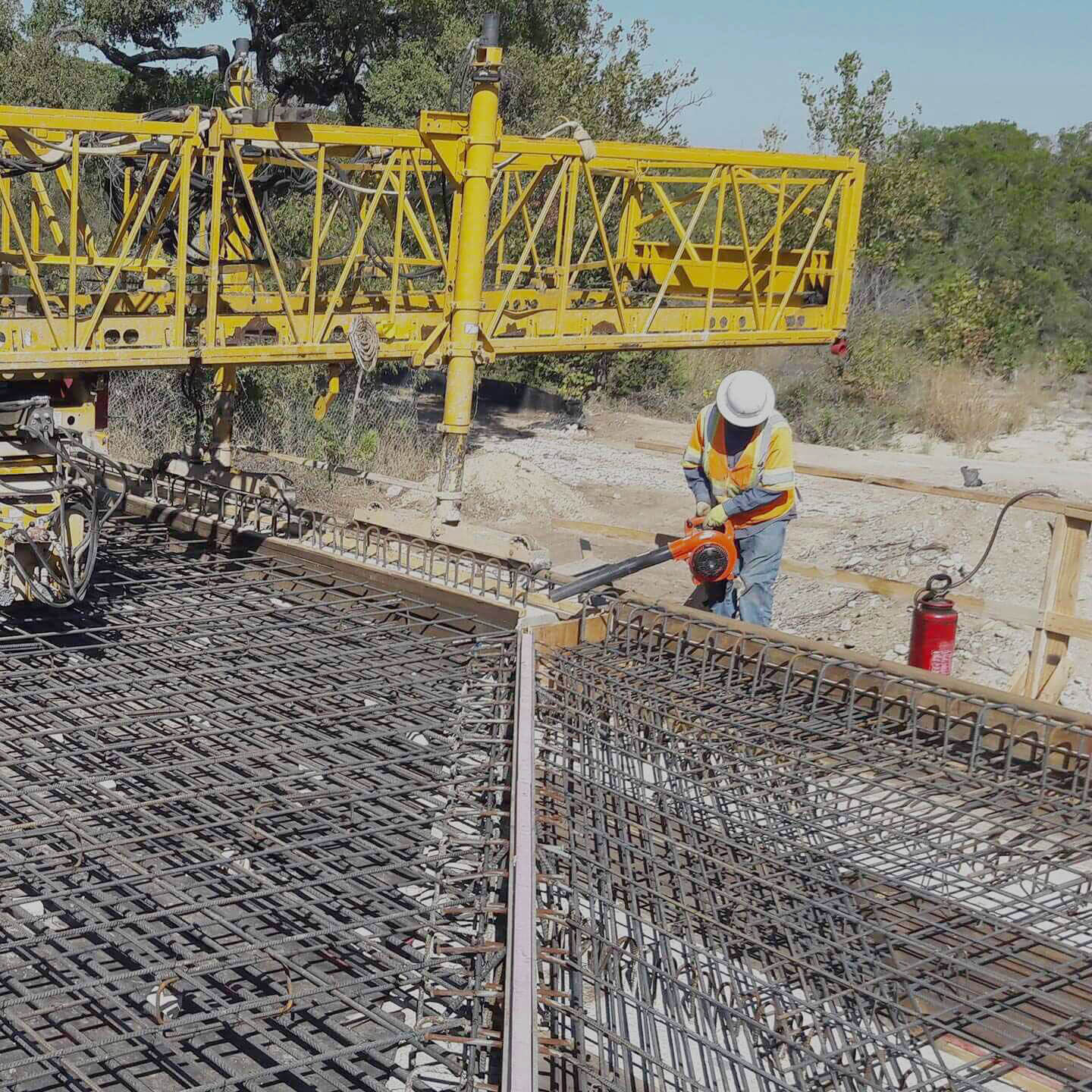 Construction worker using machinery