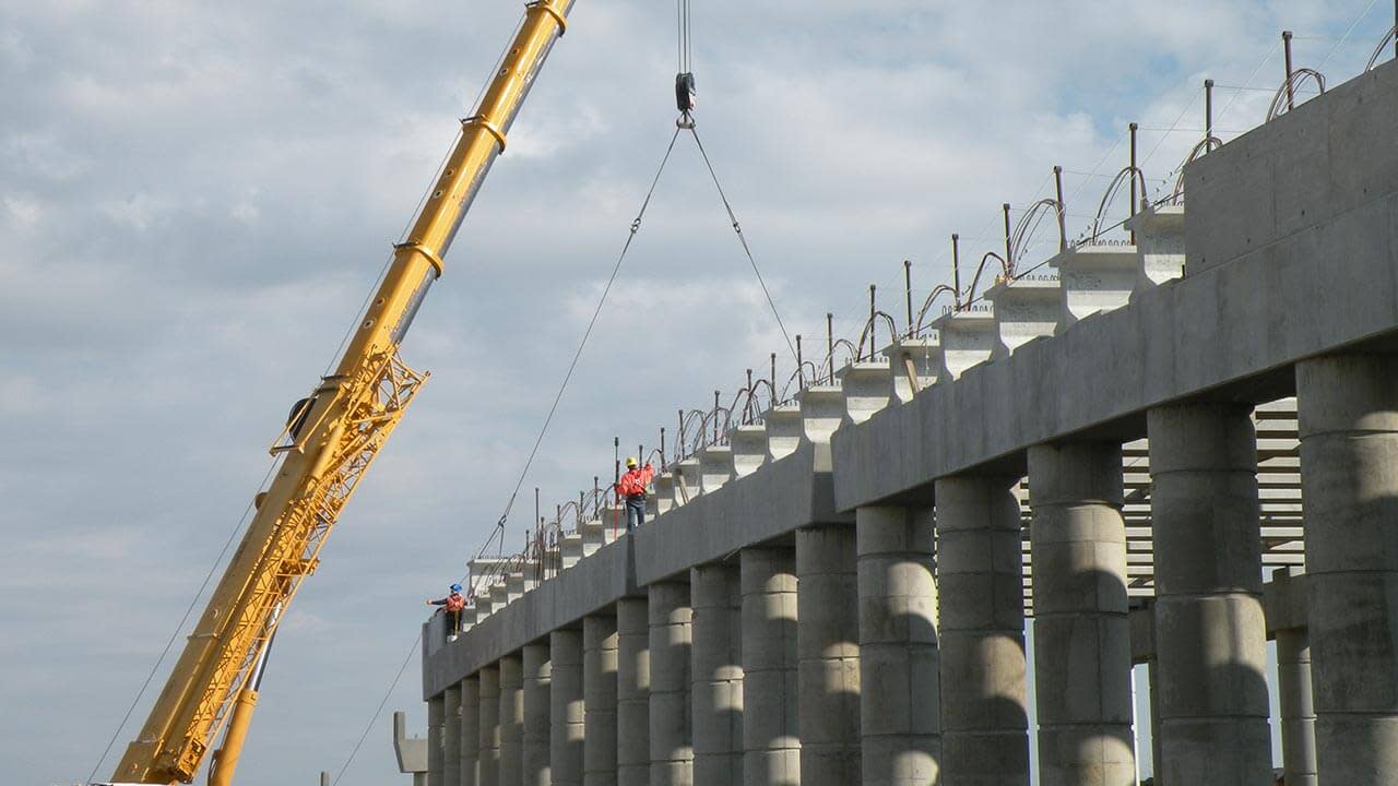 Construction workers on a bridge