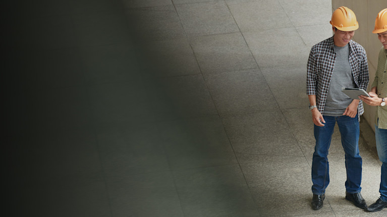 Contractors using a tablet