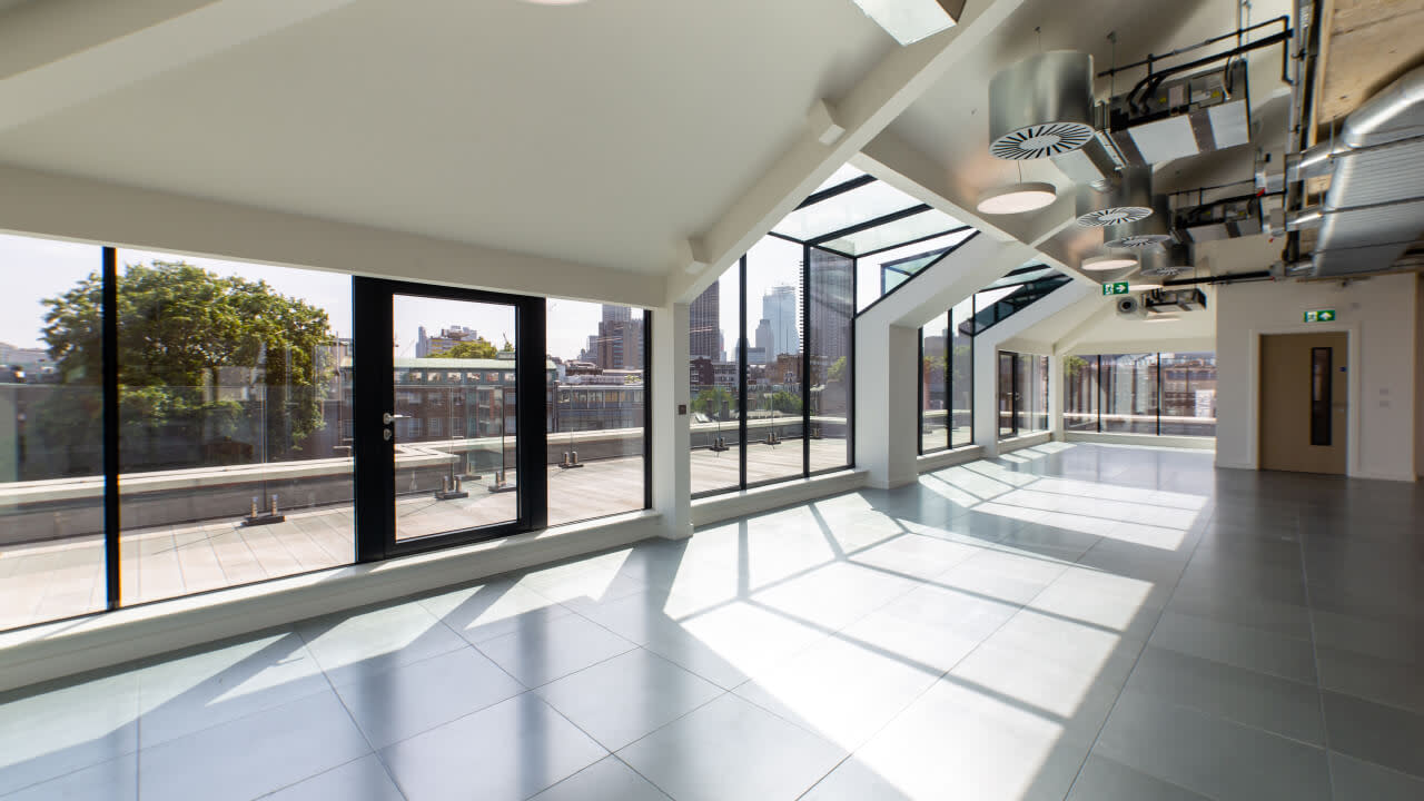 Office interior large full height windows and skylight