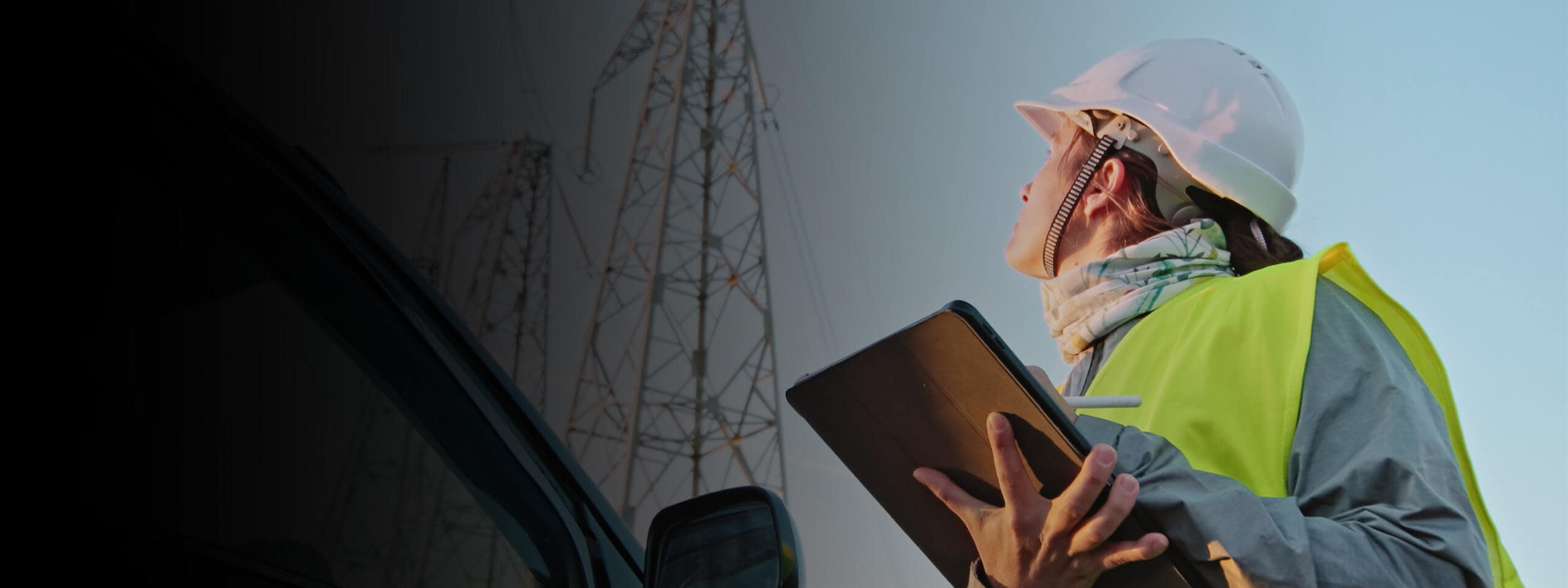 Contractor looking up while holding a tablet