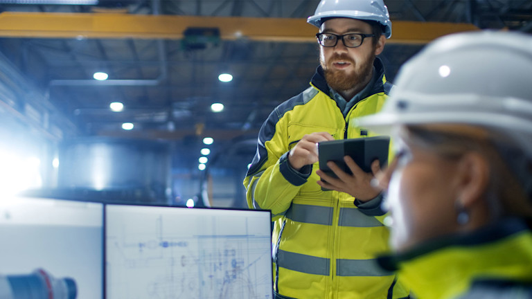 Contractors reviewing their project's blueprints