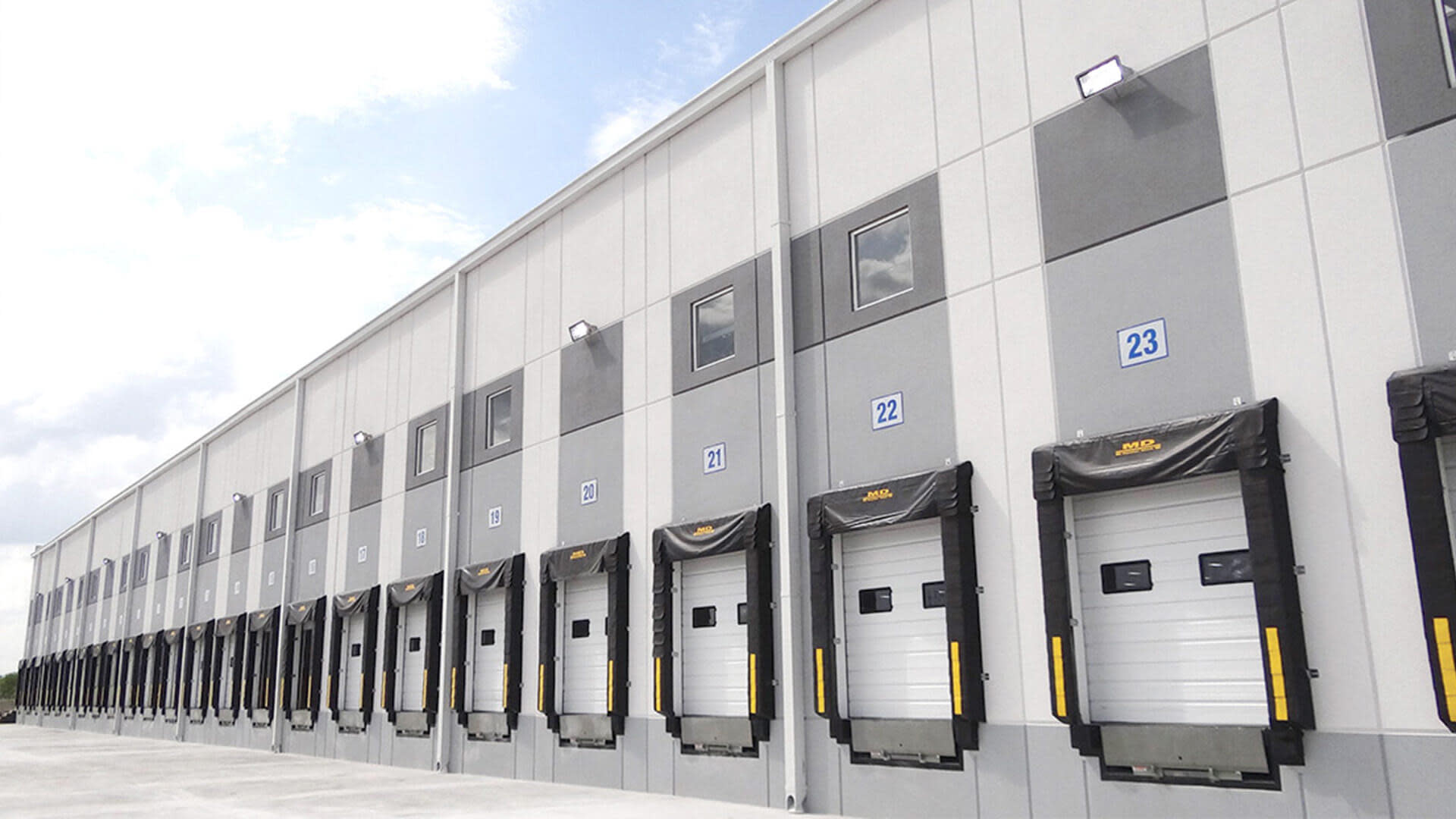 Exterior of a large truck bay at a large warehouse