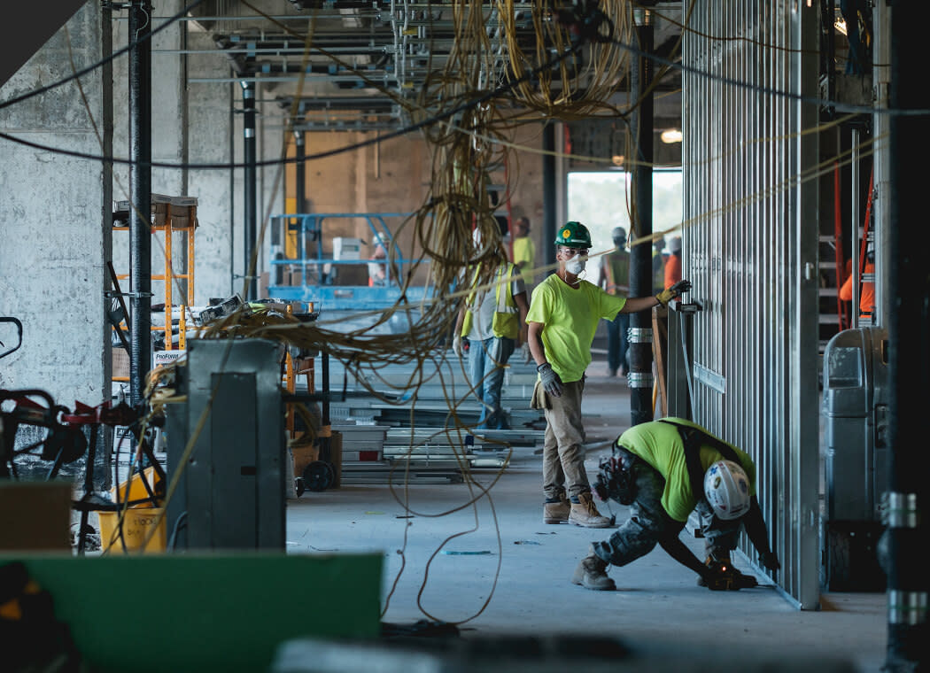 Construction workers setting up the electric cables