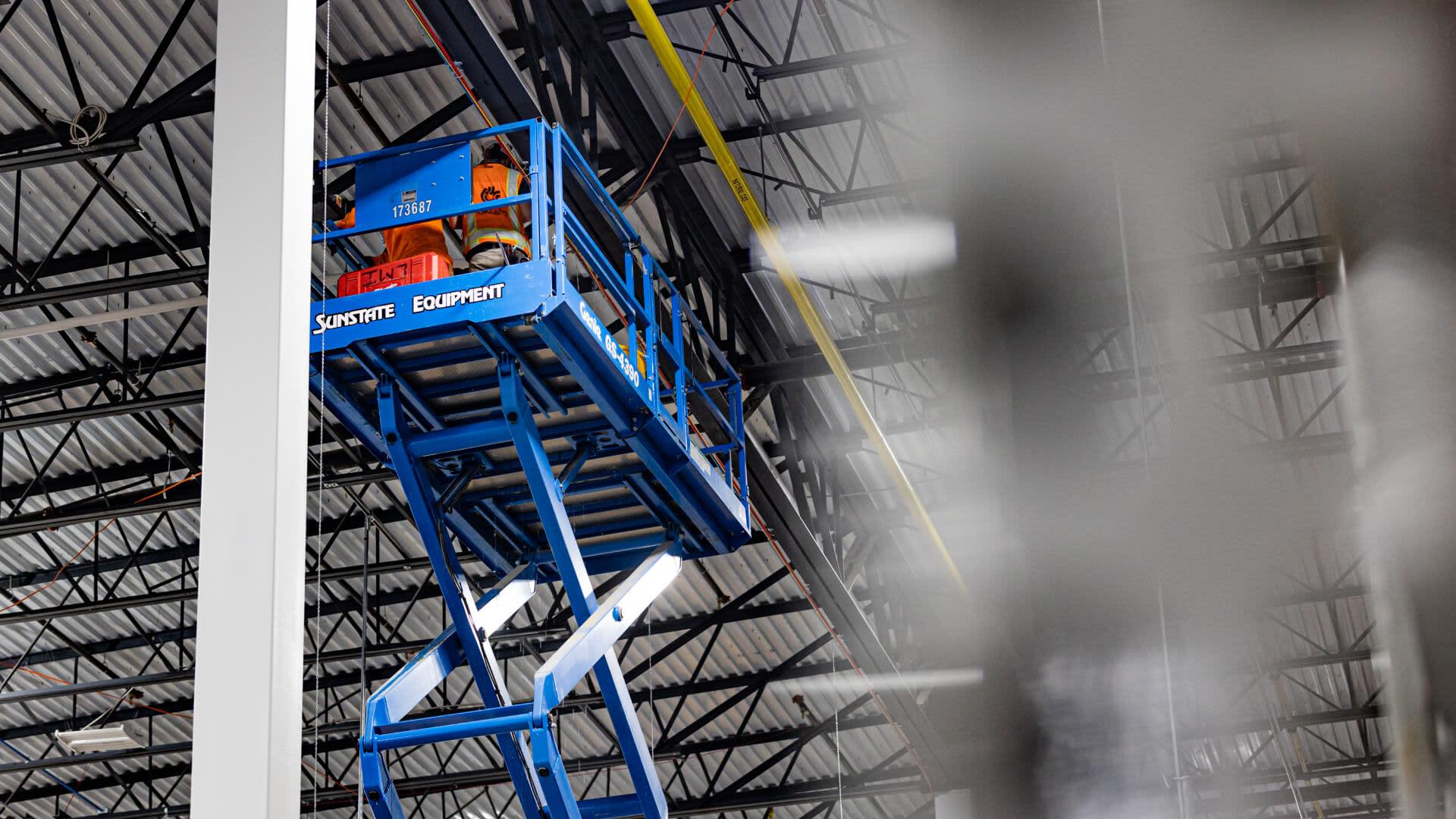 Construction worker on a scissor lift