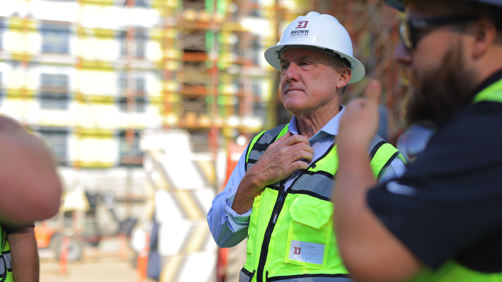 Construction workers having a conversation at a construction site