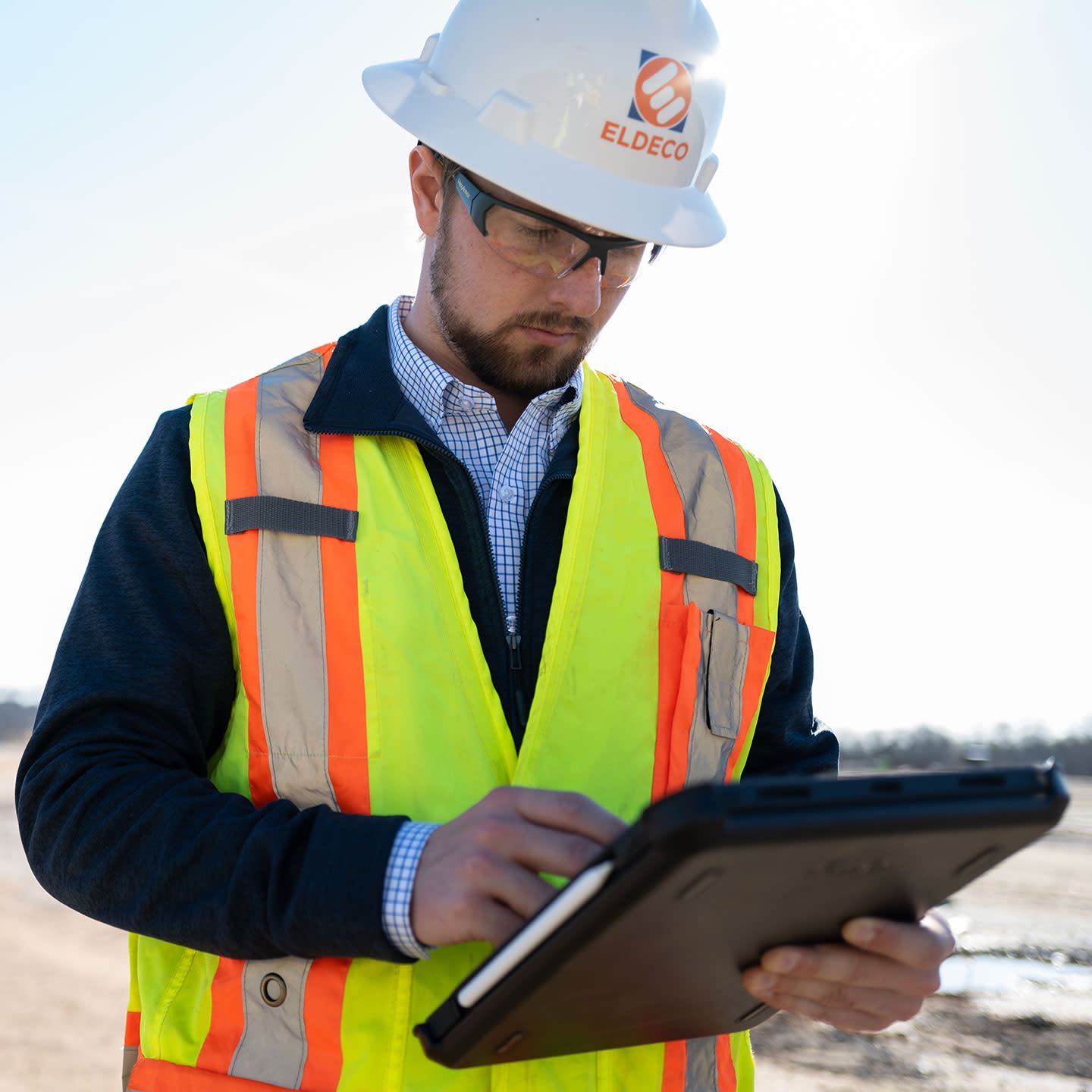 Construction worker using tablet on a jobsite
