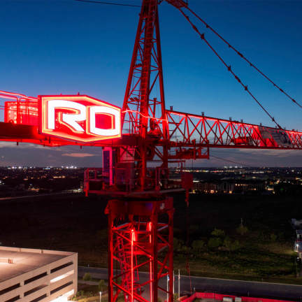 A crane with Rogers-O’Brien's logo on it