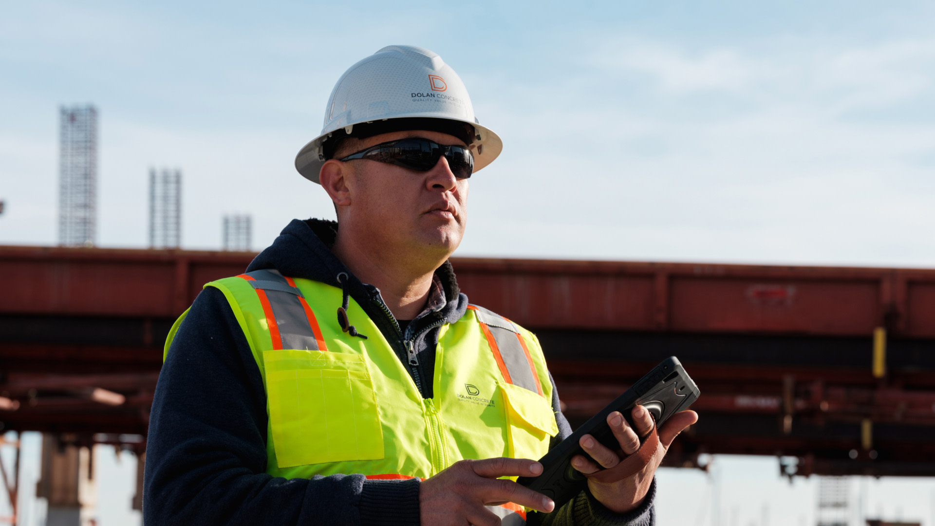 Dolan contractor working with a tablet on site