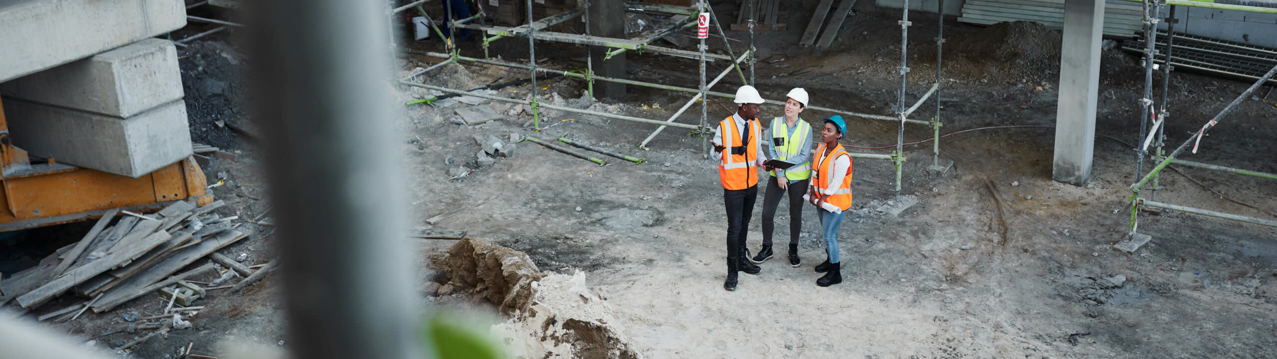 Construction workers inspecting a project