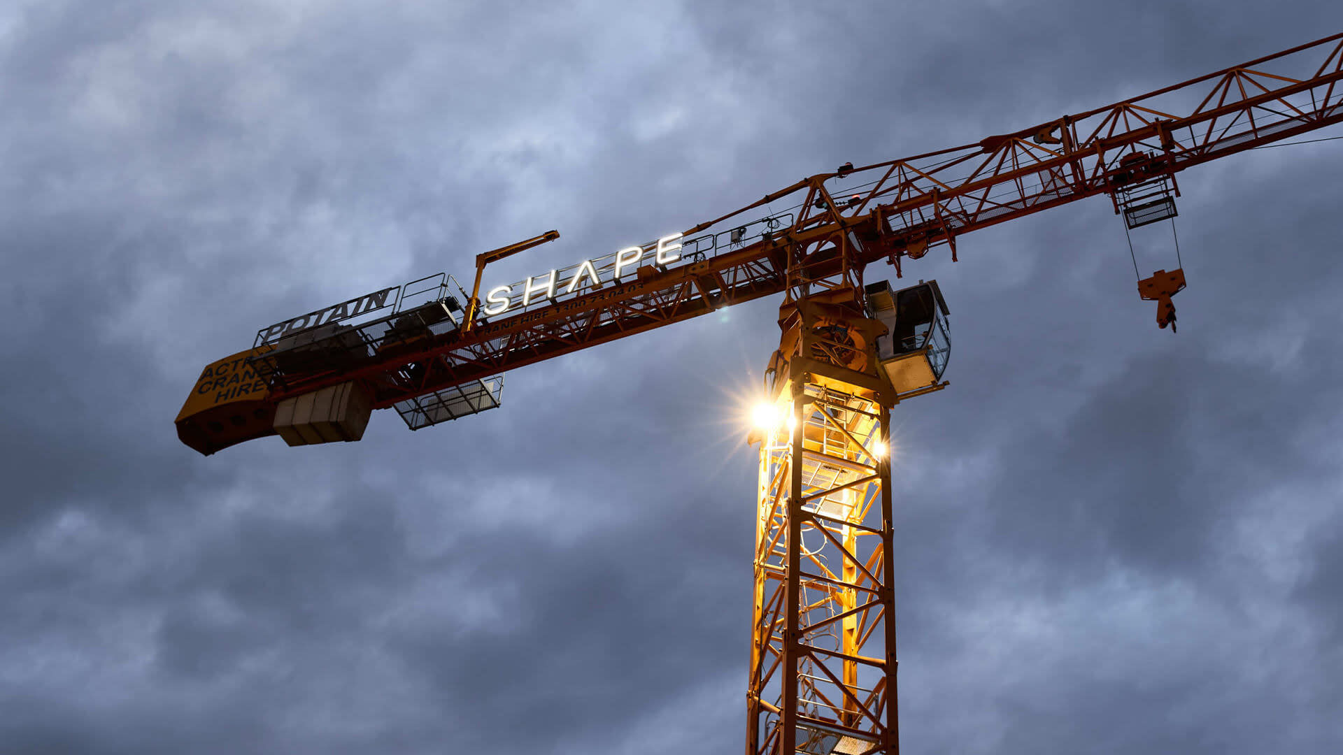 A crane with Shape's logo in it