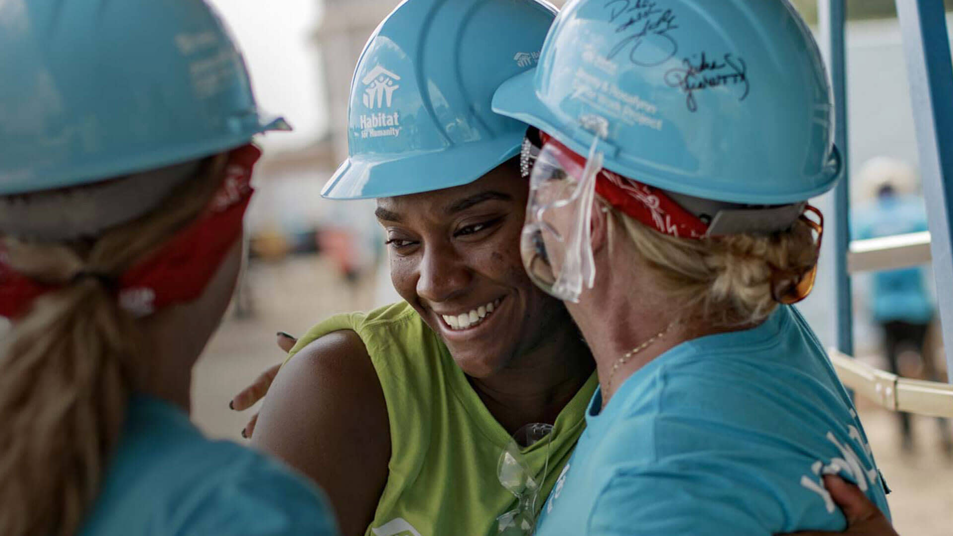 Habitat builders smiling