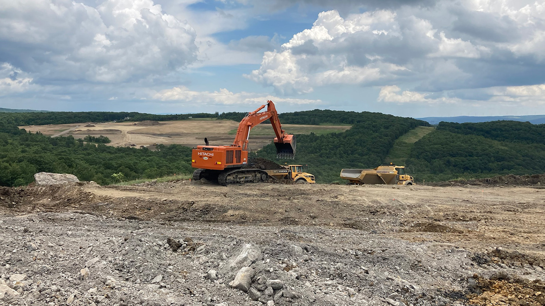 a construction vehicle on a dirt hill