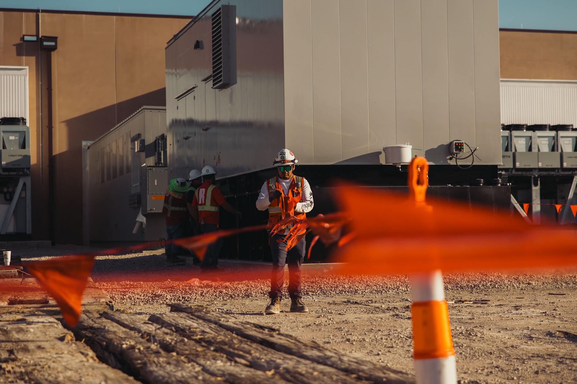 employee standing in front of a datacenter building