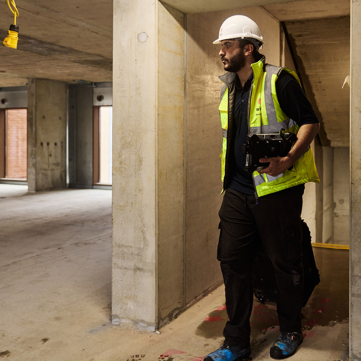 A construction worker standing on a corner of a construction