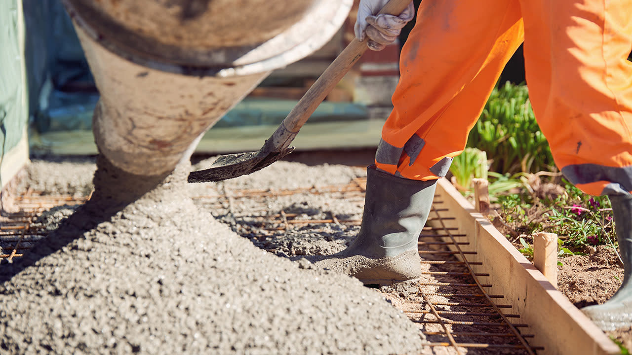 Construction worker puring concrete