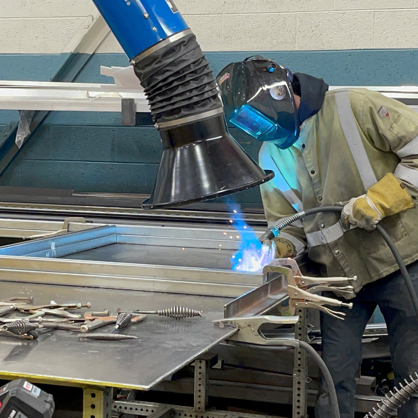 a person welding a piece of metal