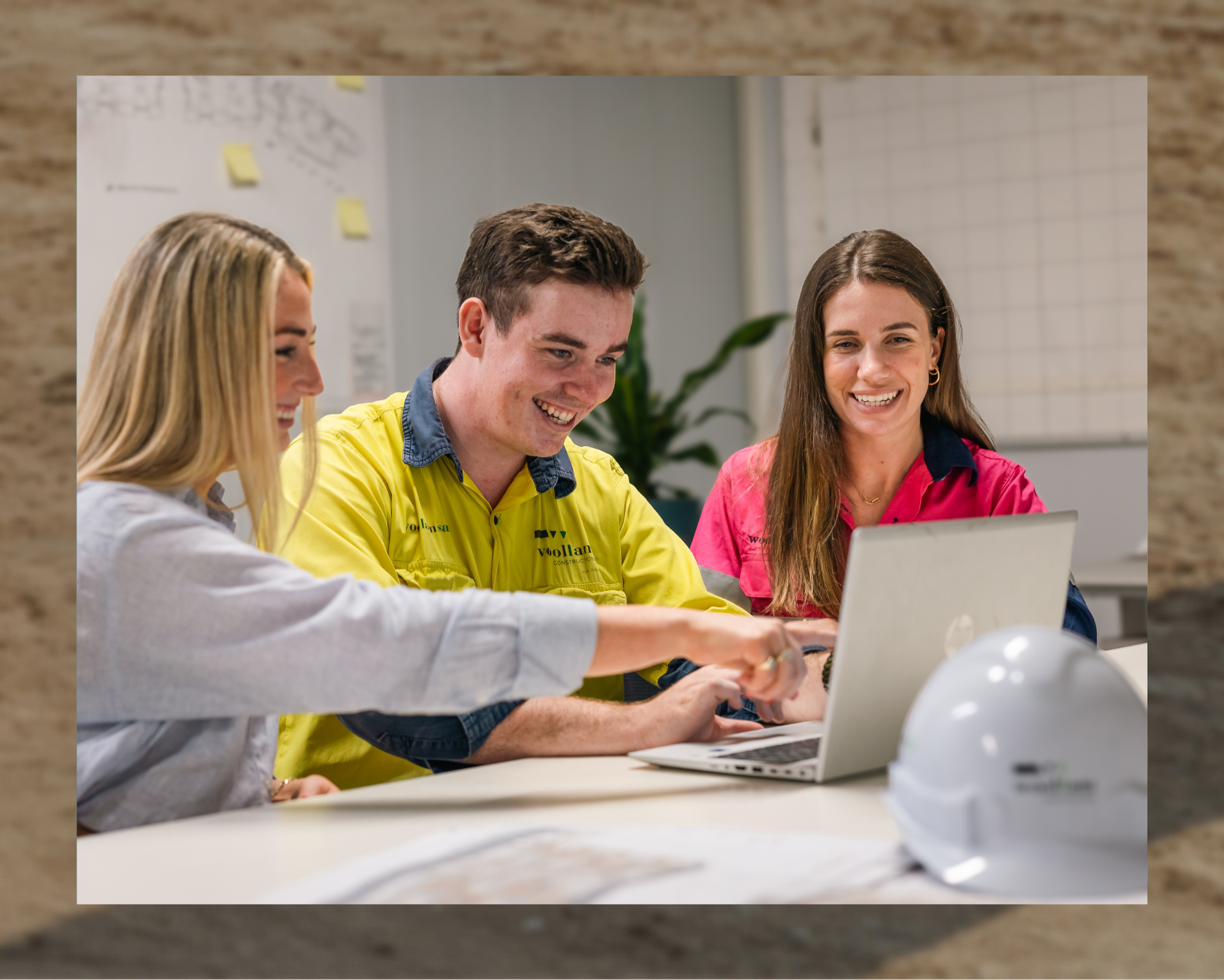 Image of construction workers discussing work