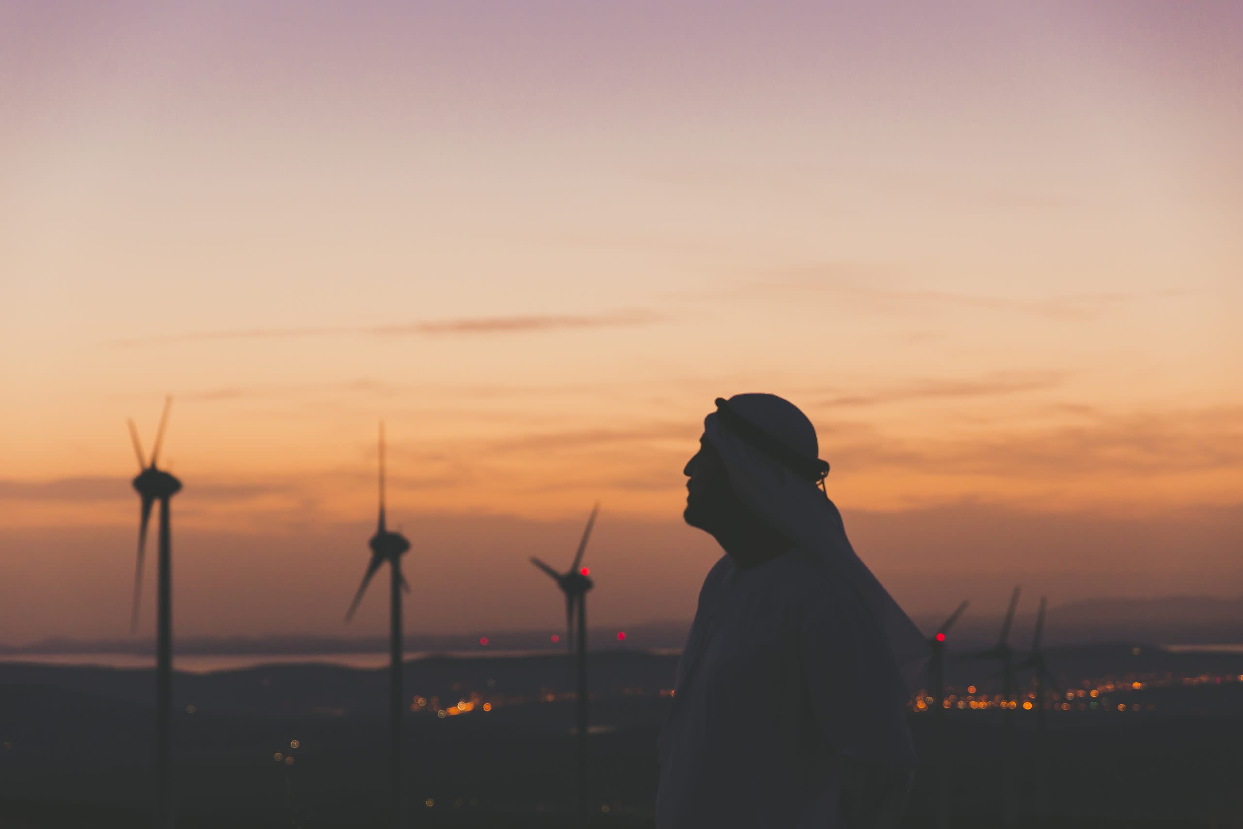 An arab man looking at the horizon during sunset