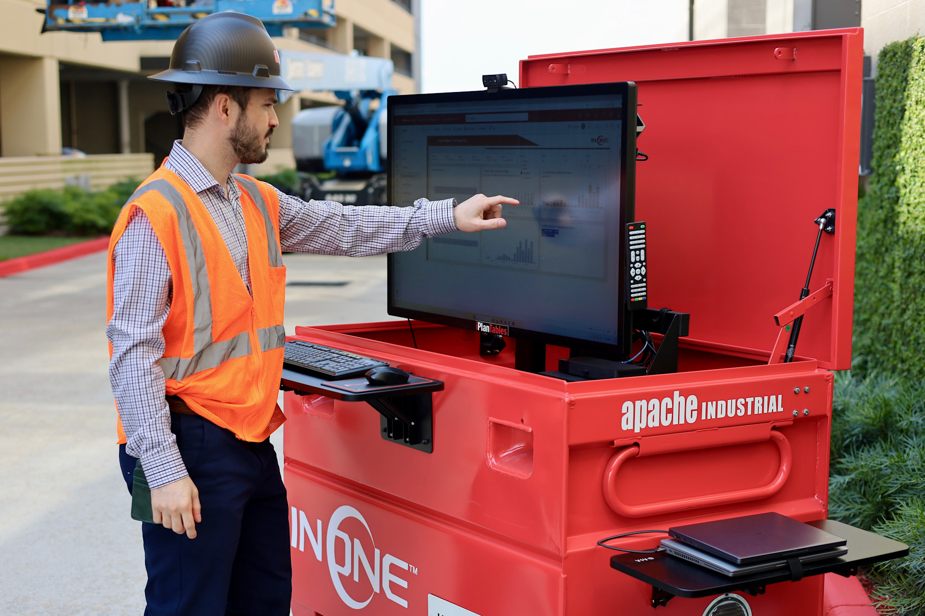 Apache employee in front of computer