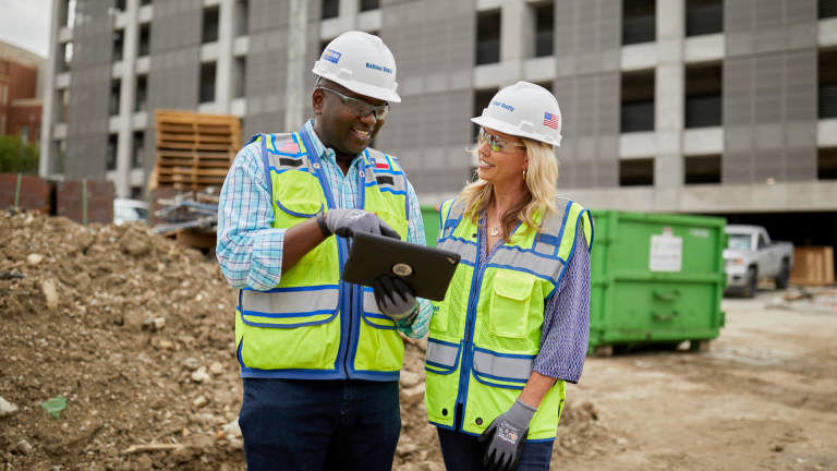 Kasey Bevans having a talk with a contractor