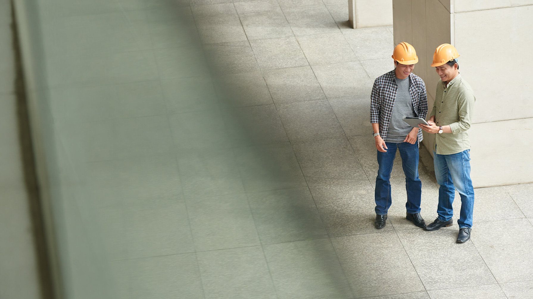 Contractors looking at a tablet