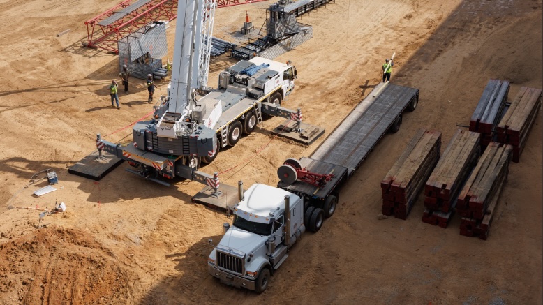 Crane truck being assembled on a civil construction site