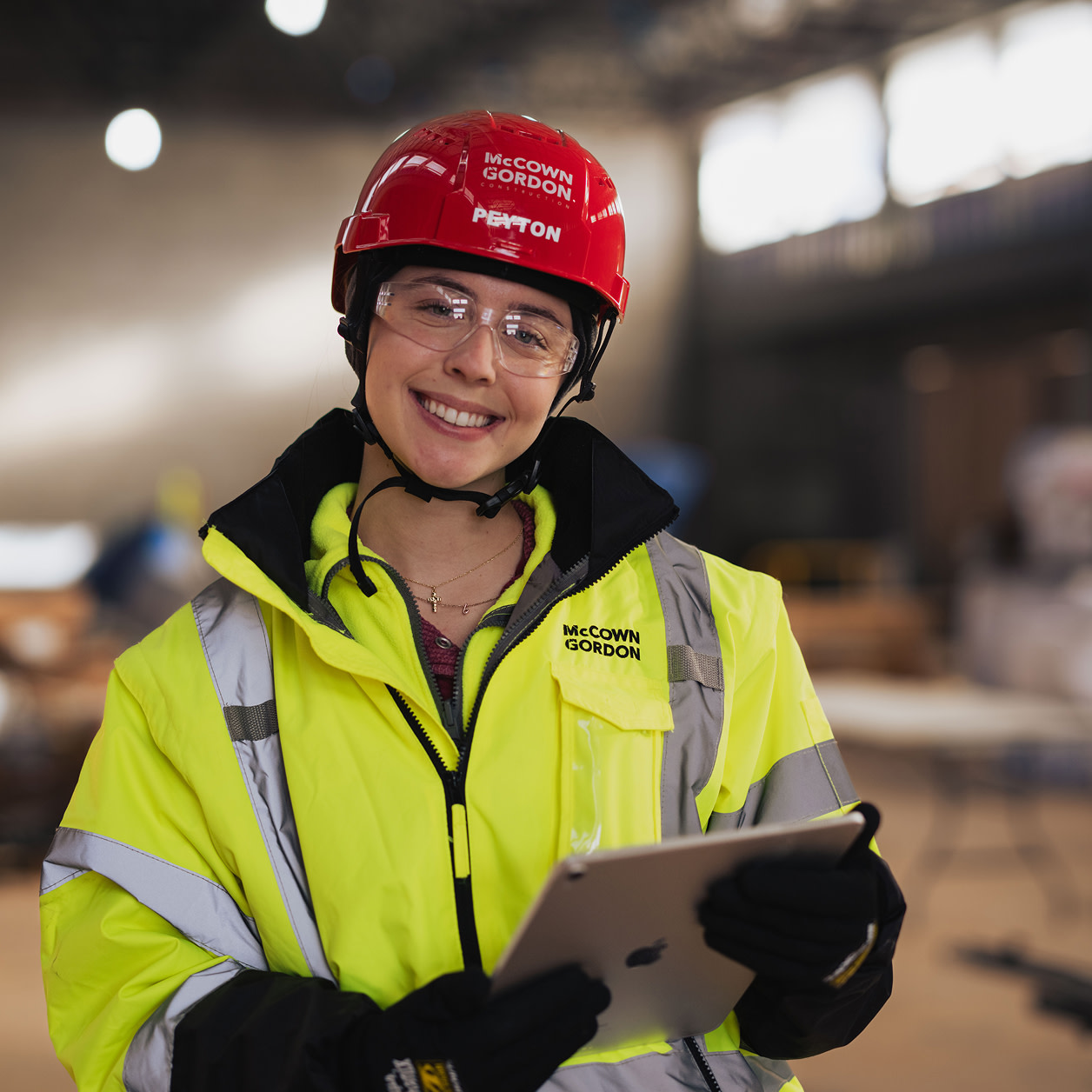 A woman contractor smiling to the camera