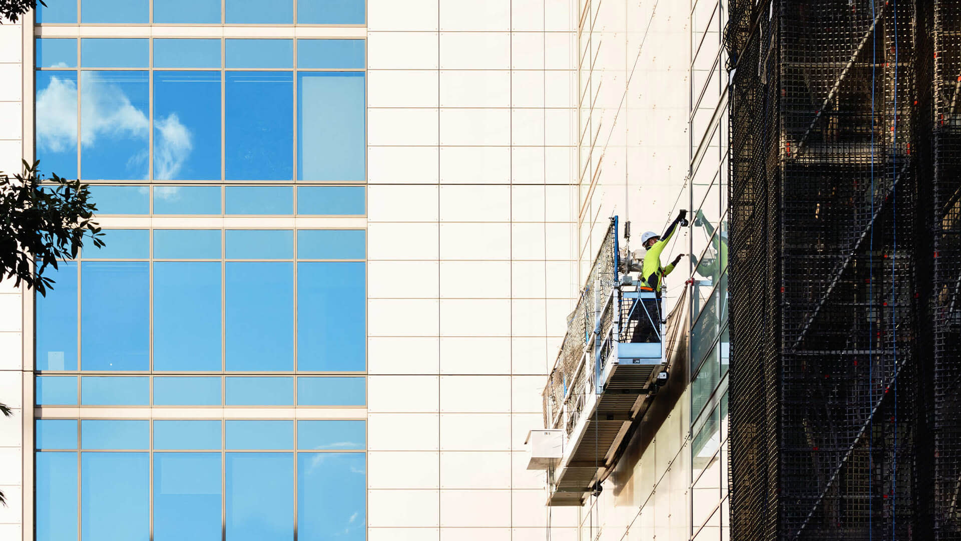 Construction worker on a suspended scaffold