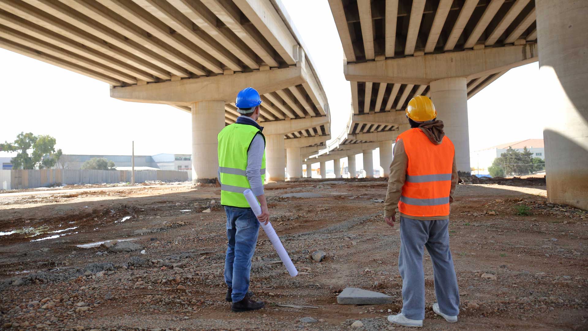 Contractors reviewing the completion of a bridge