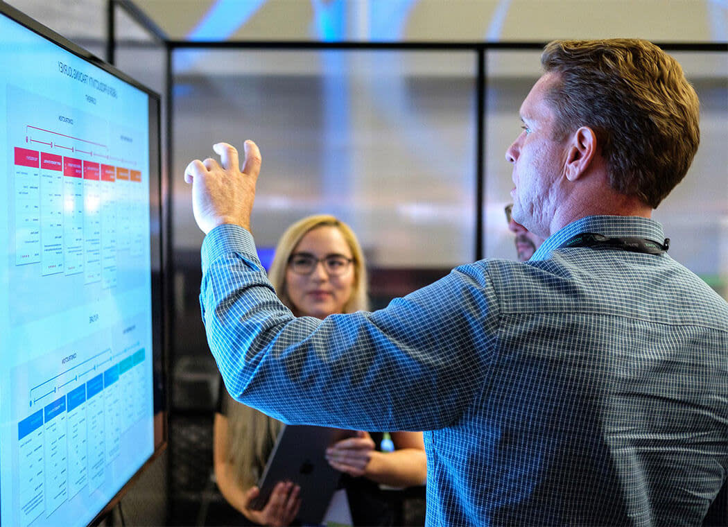 man demonstrating on a computer