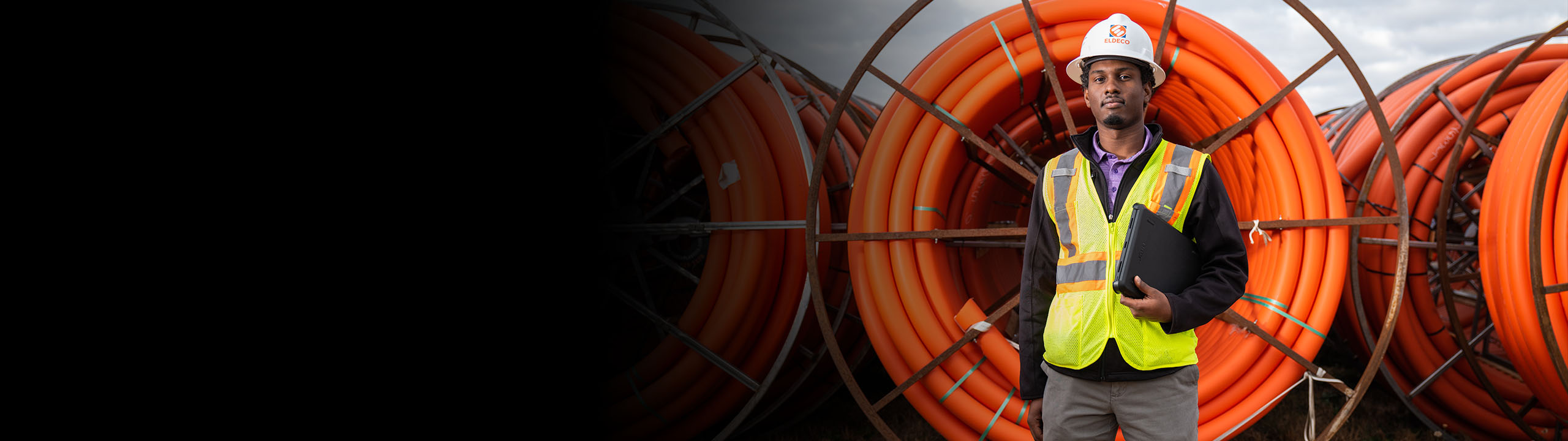 Contractor posing for the camera while standing in front of gas pipes