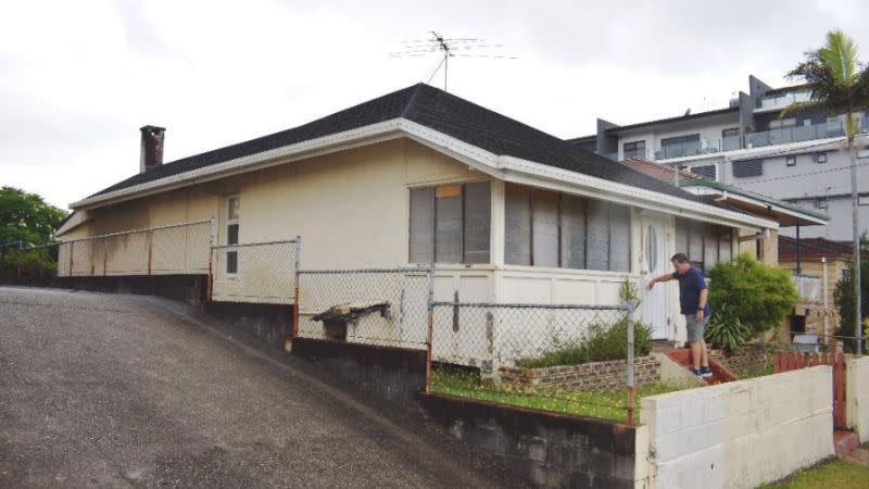 The pre-1911 brick home to be preserved and incorporated into the development design. 